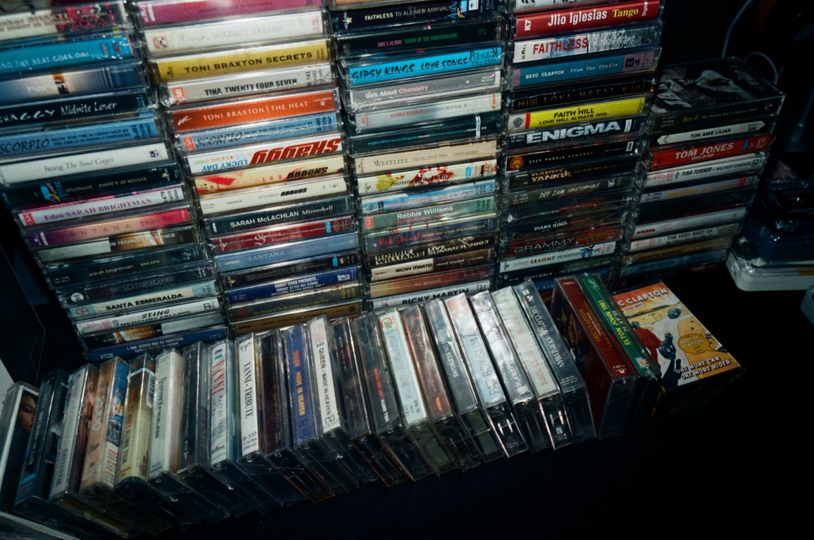 Racks of CDs and records at a stall.