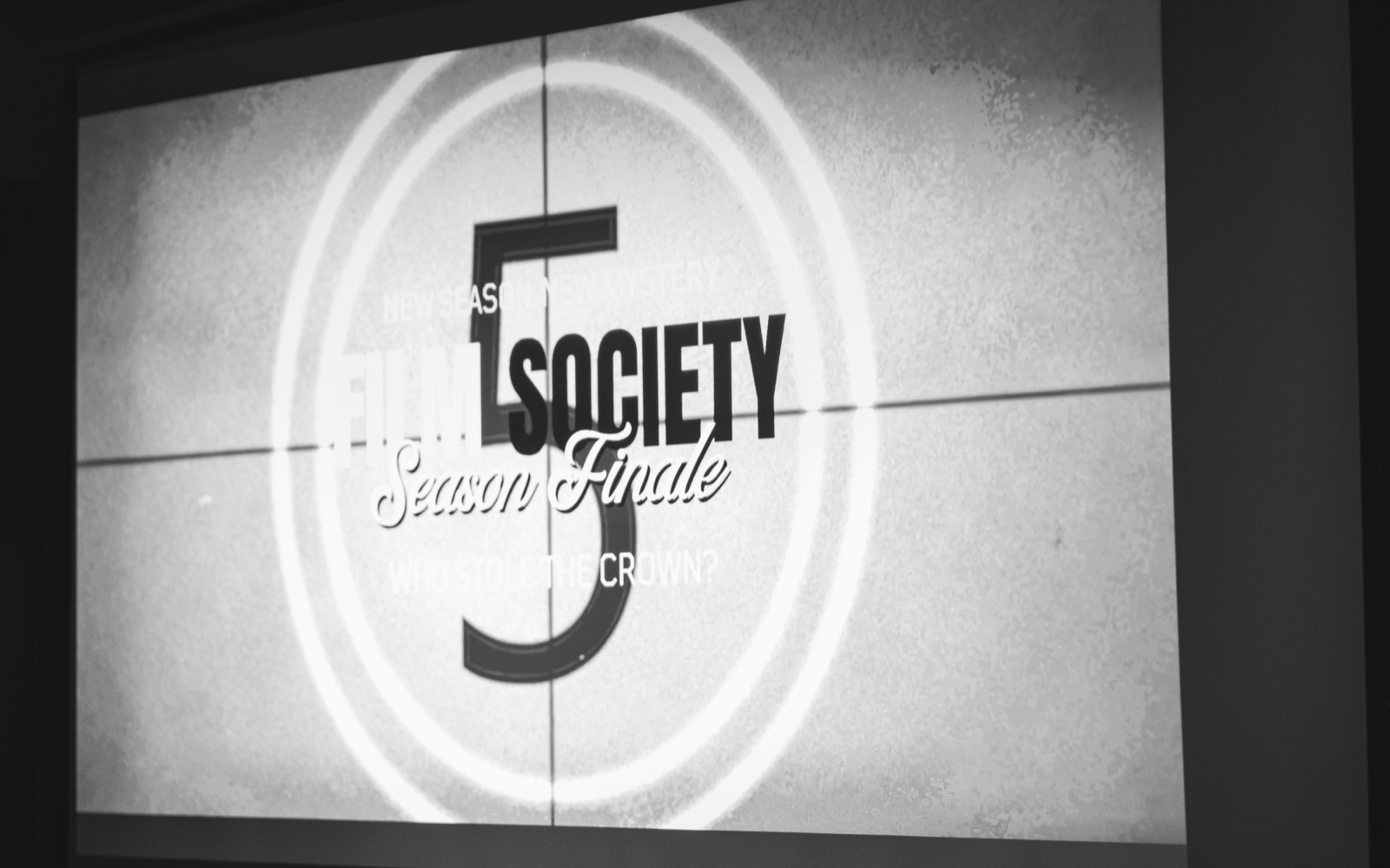 A projected slide reading Film Society, season finale.