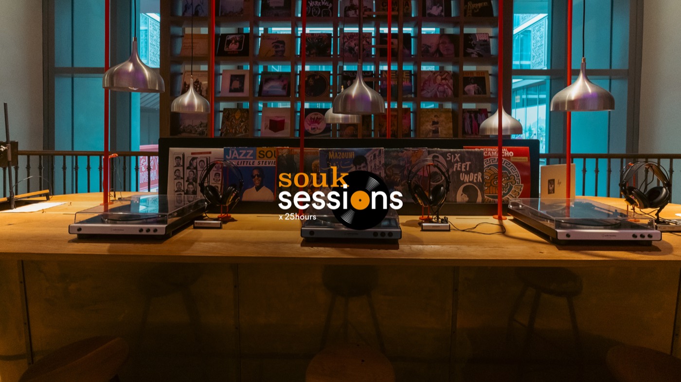 A session in a dimly lit room, with the Souk Sessions logo in the corner of the photo.